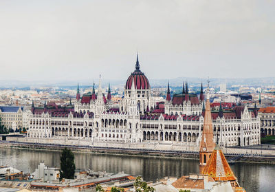 Buildings in city against sky