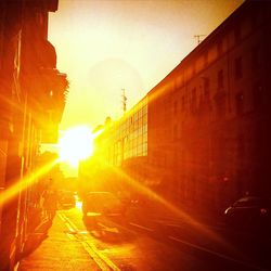 Sun shining through building