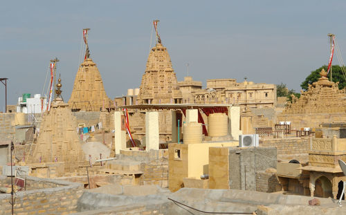 Exterior of temple against buildings in city