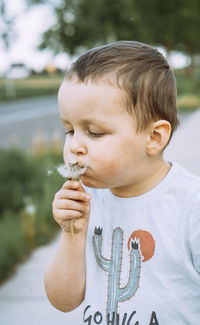 Close-up of young woman blowing bubbles