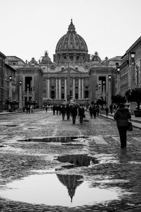 Group of people in front of buildings
