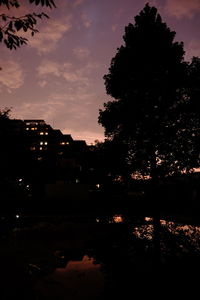 Silhouette of trees against sky at dusk