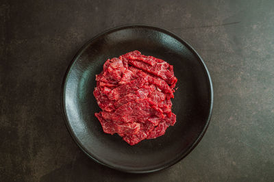 High angle view of red cake in plate