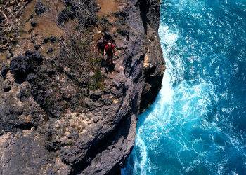 High angle view of rocks in sea