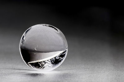 Close-up of crystal ball on table