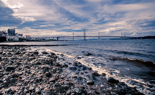 Bridge over sea against sky 