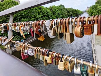 Padlocks hanging on railing