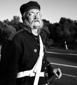 Portrait of man standing on road