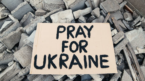 Abandoned billboards on the debris of buildings destroyed by bombing in ukraine