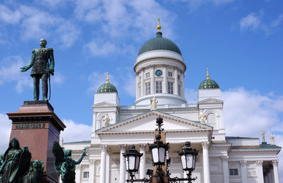 Low angle view of statue of building against sky