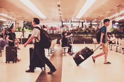 Group of people walking in airport