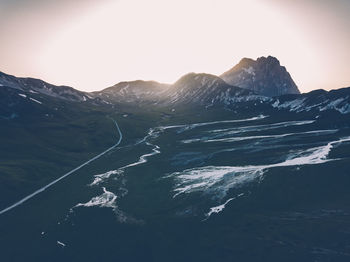 Aerial view of snowcapped mountains against sky