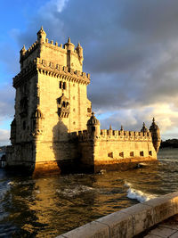 Torre de belem is an historic building close to the ocean in lisbon. belem tower