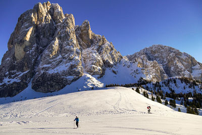 Scenic view of snowcapped mountain against clear blue sky