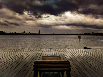 Scenic view of sea against storm clouds