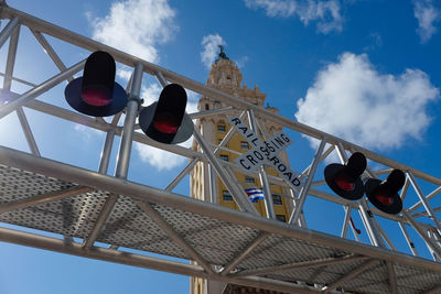 Low angle view of sign against built structure