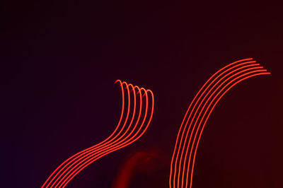 Close-up of light painting against black background