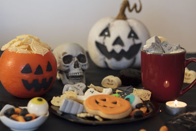 Close-up of birthday cake with pumpkin on table