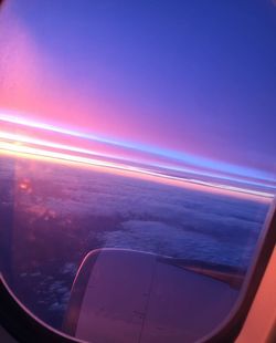 Aerial view of sea seen through airplane window