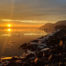 Scenic view of sea against sky during sunset