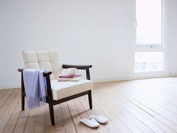 Empty chairs and tables in room