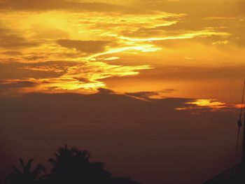 Low angle view of dramatic sky during sunset