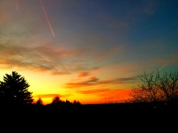 Silhouette landscape against sky during sunset