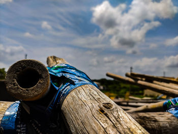 Close-up of wood against sky