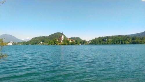 Scenic view of calm lake against clear sky