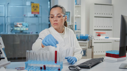 Young scientist experimenting at lab