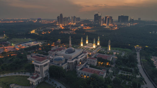 High angle view of illuminated buildings in city