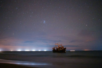 Scenic view of sea against sky at night