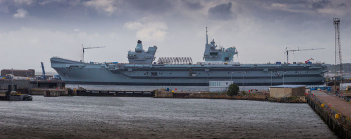 Panoramic view of commercial dock against sky