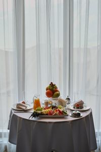 Food served on table against window