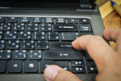 Midsection of person using mobile phone