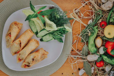 High angle view of vegetables in plate on table