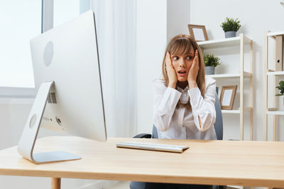 Businesswoman working at desk in office