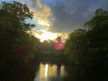 Scenic view of lake at sunset