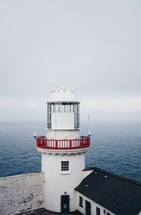 Built structure on sea against sky