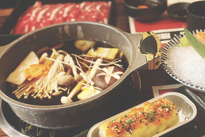 Hot pot and japanese slimming food are on the table