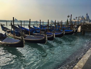 View of boats in sea at sunset