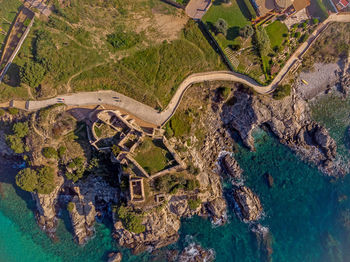 High angle view of sea by rock formation