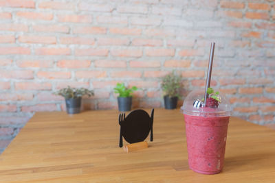 View of drink on table against wall