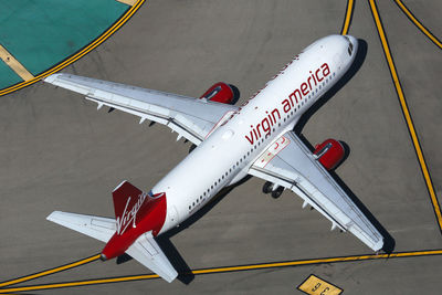 High angle view of airplane on airport runway