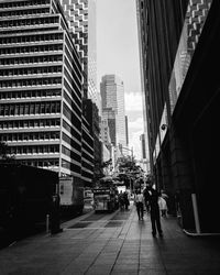 People walking on modern office buildings