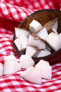 Coconut pieces spilling out of a coconut shell