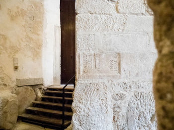 Staircase in front of wall