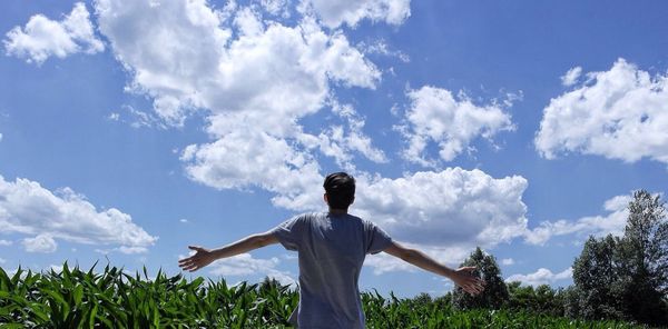 Low angle view of man standing on landscape