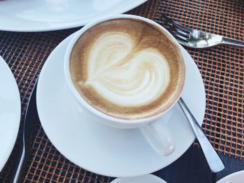 High angle view of cappuccino on table