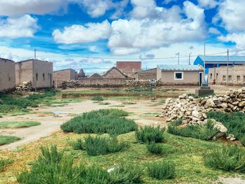 View of buildings against cloudy sky